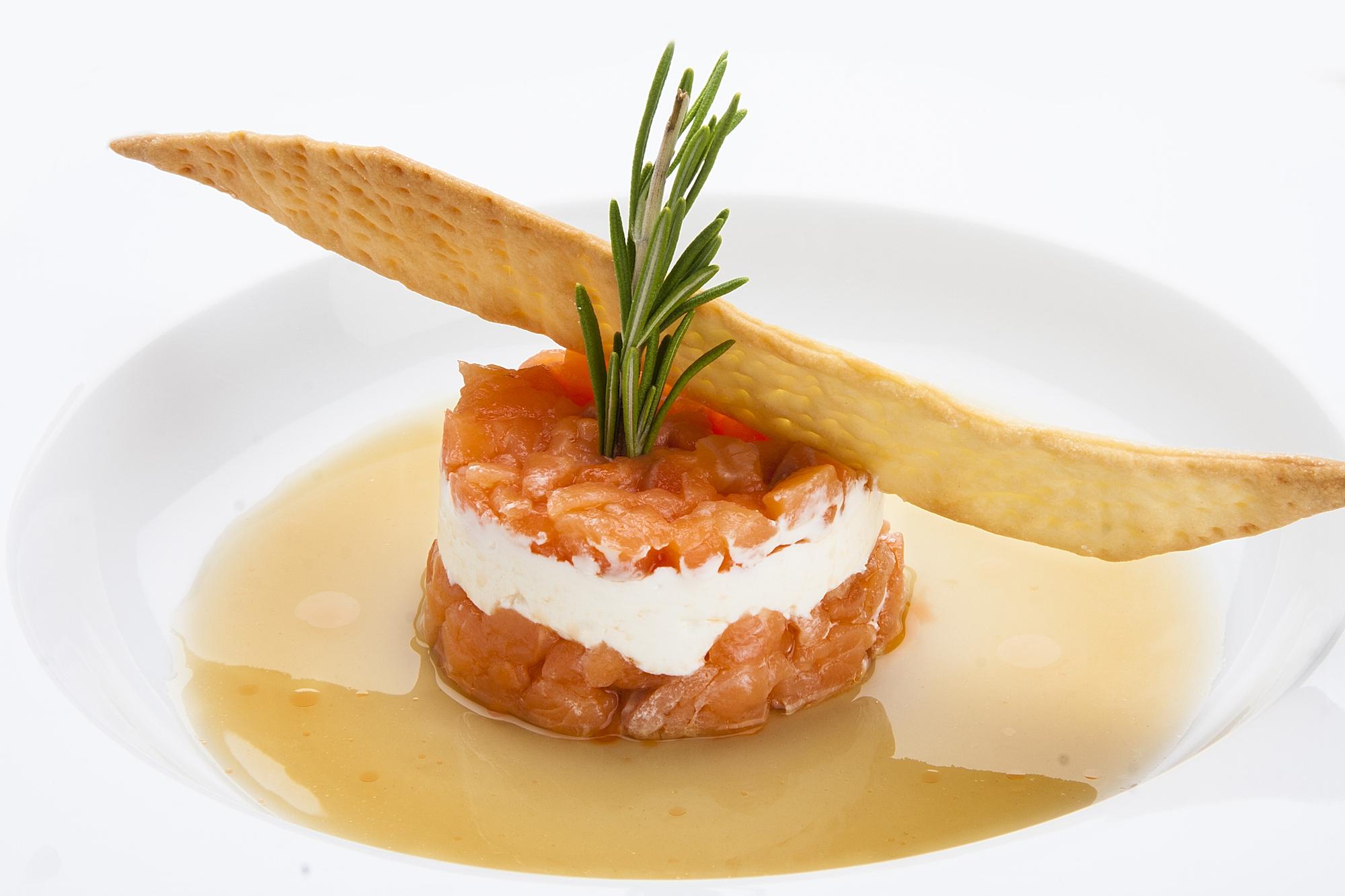 Close-up of plated amuse-bouche with sauce