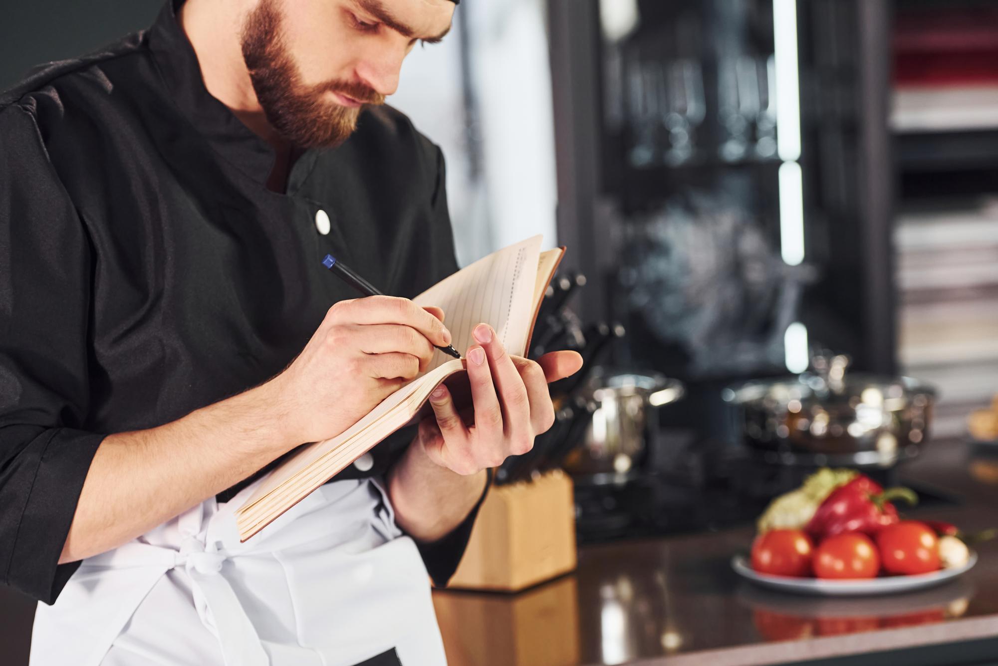 Chef preparing menu concept on paper
